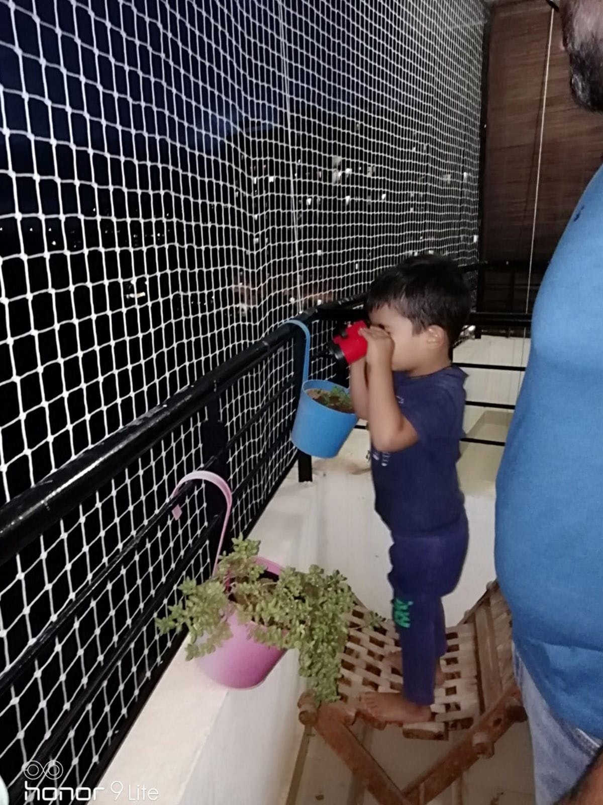 Children safety net on high-rise balcony