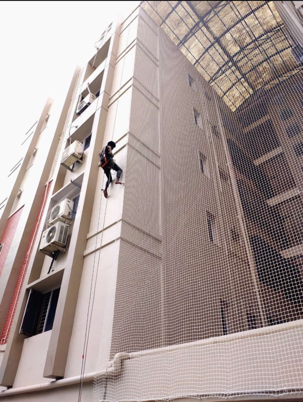 Duct area safety net installed in apartment building