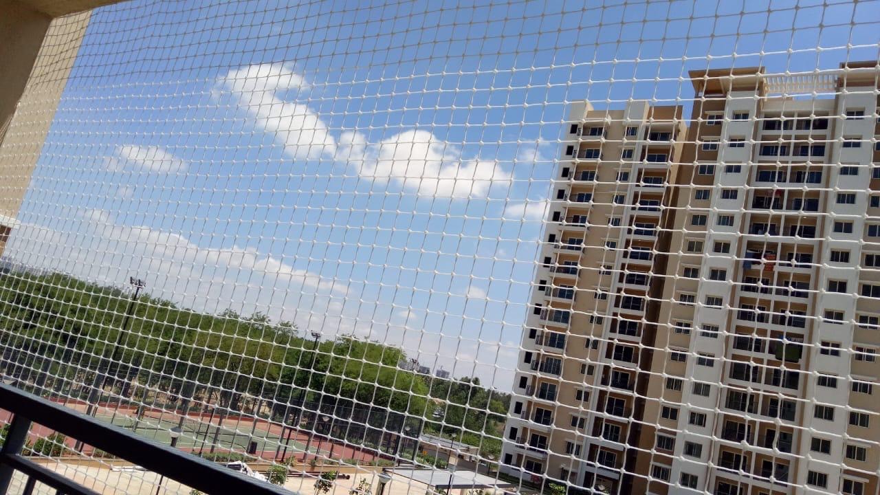 Pigeon net installed on apartment balcony